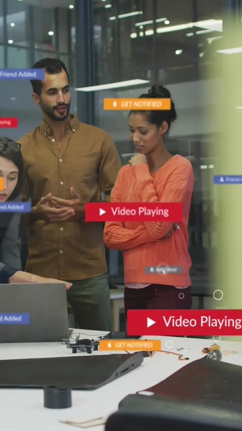 Vertical video: Lead clicking play, overlay shifting, team typing and testing Stock Footage 334598487