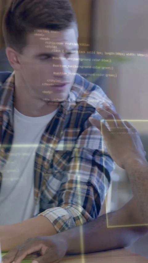 Vertical video: Lead dev watching monitor, junior dev typing and causing UI code 스톡 동영상 335264280