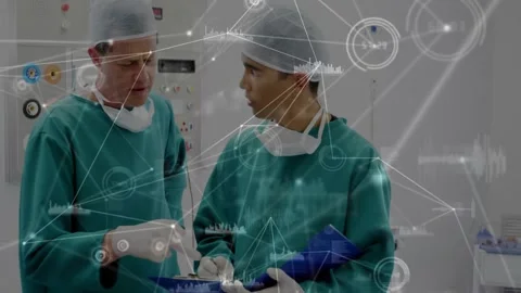 Vertical video: Lead Dr pointing blue folder, activating HUD, junior handling Stock Footage 330676009