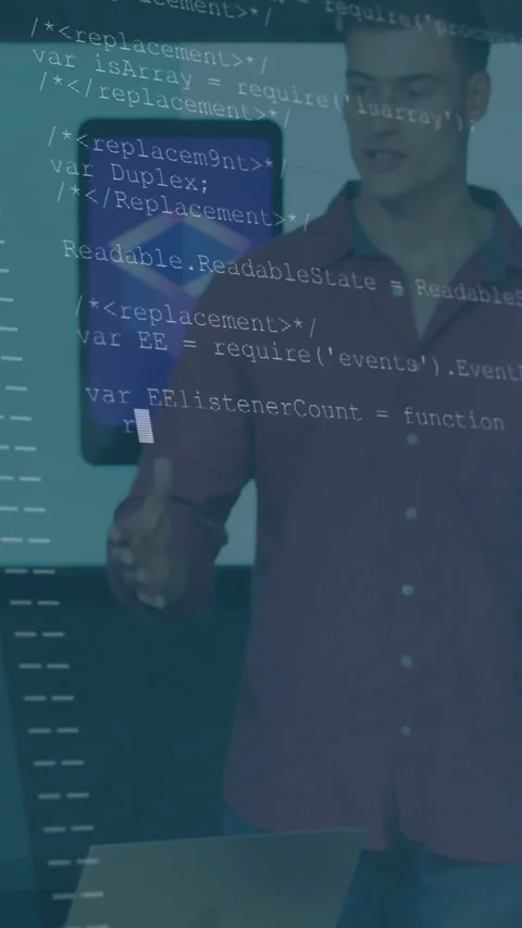 Vertical video: Lead at laptop, gesturing, explaining tech demo while wall logo Stock Footage 330242561