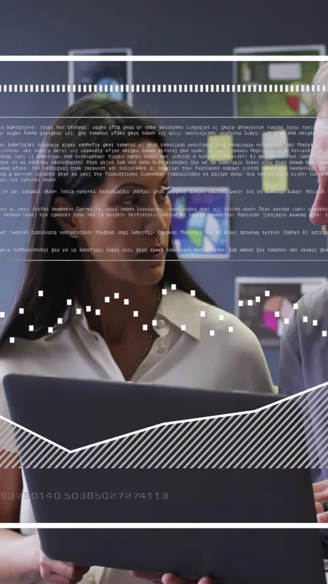 Vertical video: Lead opening demo holding laptop showing tech data while Stock Footage 334541298