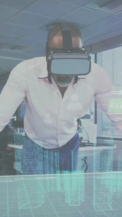 Vertical video: Lead placing hands on table wearing VR headset, inspecting 3D Stock Footage 334391702