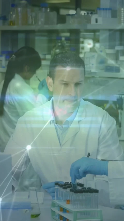 Vertical video: Lead reacting as gloved hand handing sample, processing lab Stock Footage 334386360