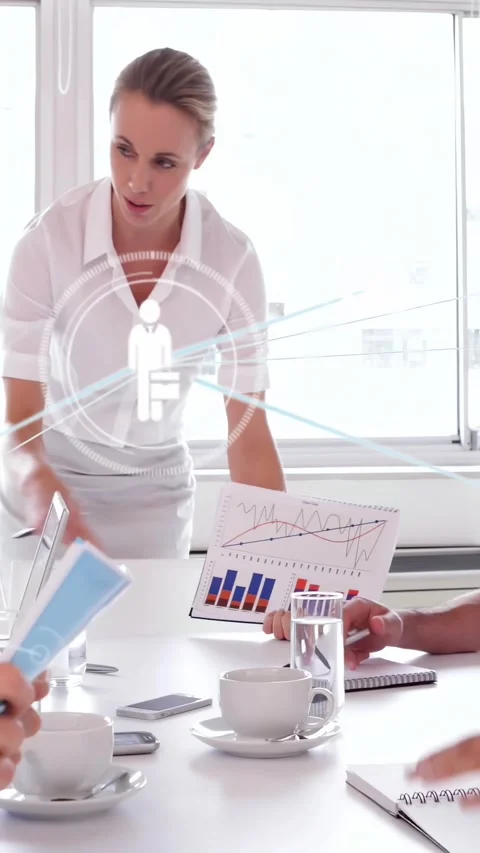 Vertical video: Lead showing chart, sparking overlay linking blue folder to data Stock Footage 334602676
