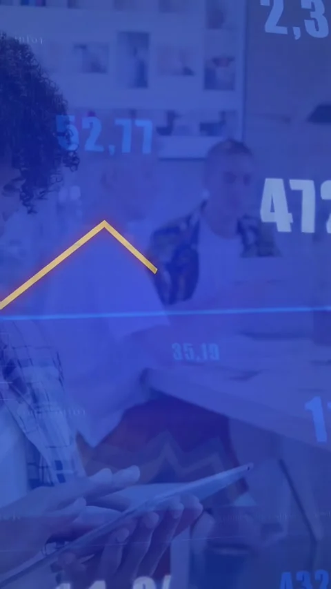 Vertical video: Lead tapping tablet showing data overlay orange line spiking, Stock Footage 333079599