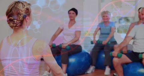 Vertical video: Leading braided coach cueing class showing raises at gym, balls Stock Footage 334179019