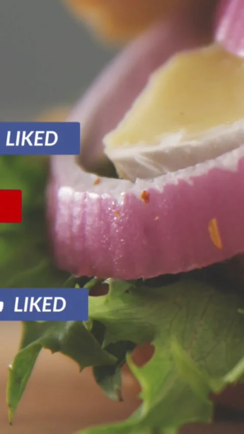 Vertical video: Lettuce onion rings cheese sitting as alert firing and badges Stock Footage 334386556