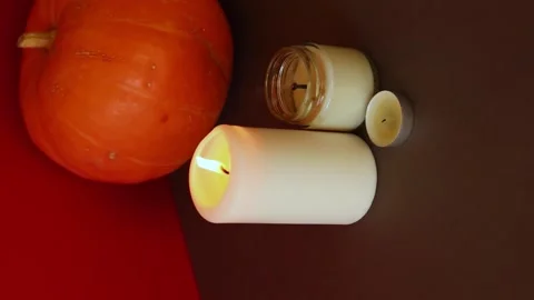 Vertical Video. lighted candles with pumpking on table. Halloween atmosphere Video stock 147893696