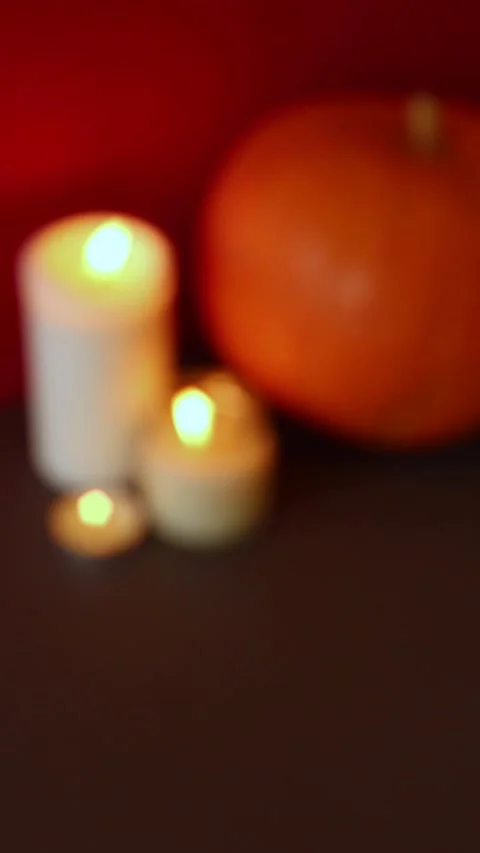 Vertical Video. lighted candles with pumpking on table. Halloween atmosphere Video stock 152446258
