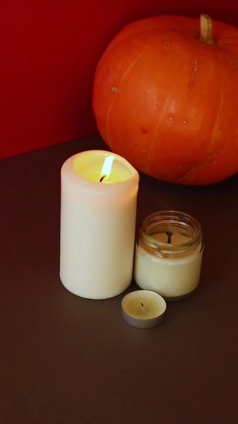 Vertical Video. lighted candles with pumpking on table. Halloween atmosphere Vídeo Stock 152446441
