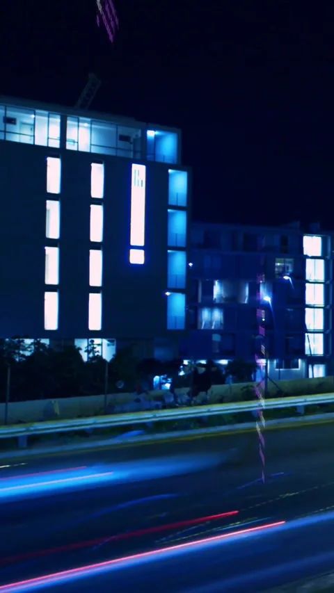 Vertical video: Lit tower showing code overlay on data pulse, blocks shifting Stock Footage 329552831
