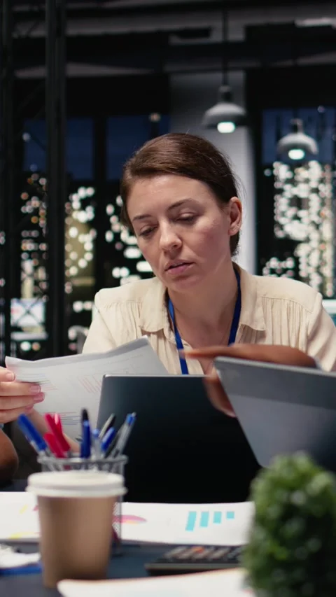 Vertical Video Looking over paperwork documents, diversity and team of employees Stock Footage 334104255