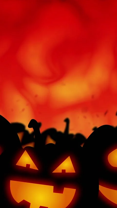 Vertical video: On loop start carved pumpkins pulsing, fog swirling, embers Stock-Footage 348570560