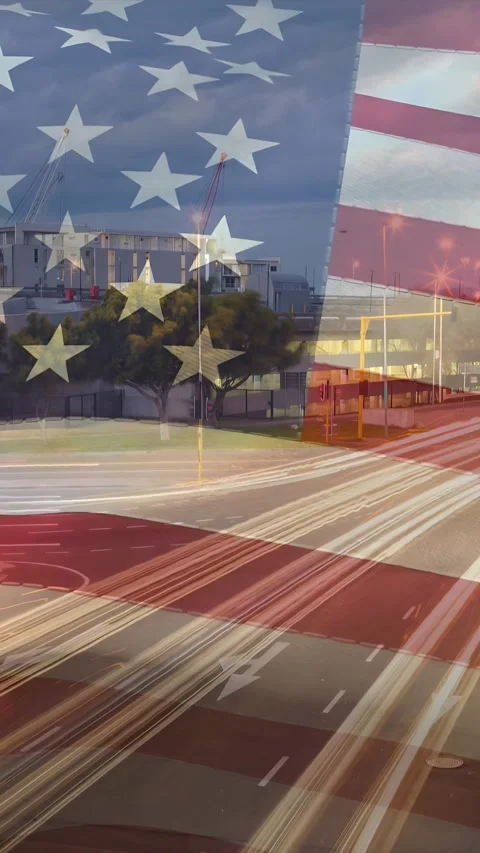 Vertical video: Looping, US flag overlay rippling over road, light trails Stock Footage 334024940