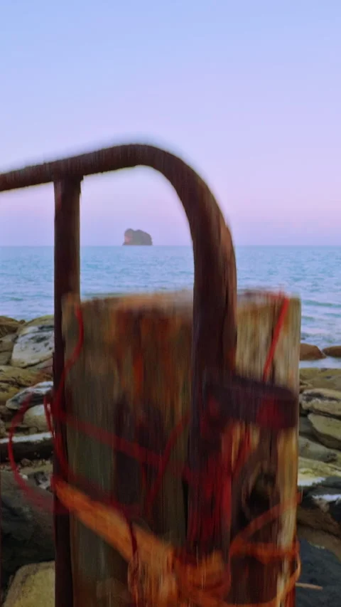 Vertical video. Low Angle Close Up Of Rusted Metal Support And Rope On Coastal P Stock Footage 328393812