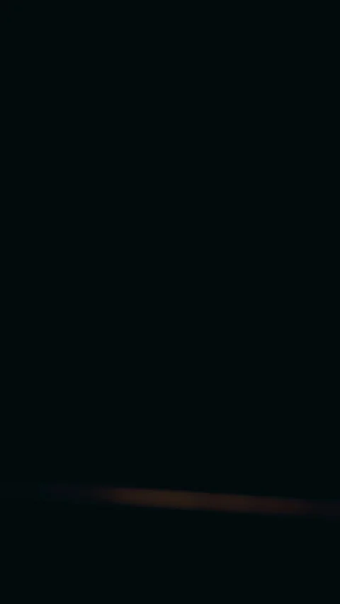 Vertical video. Low Angle View of Interior Door Slowly Opening While Unknown Sha Stock Footage 339188750
