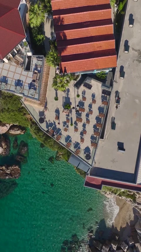 Vertical Video of a Luxurious Cliffside Restaurant With an Infinity Pool and Stock Footage 300353989