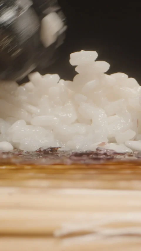 Vertical video. Macro Close-Up of a Hand in a Black Glove Evenly Distributing Vídeo Stock 305022037