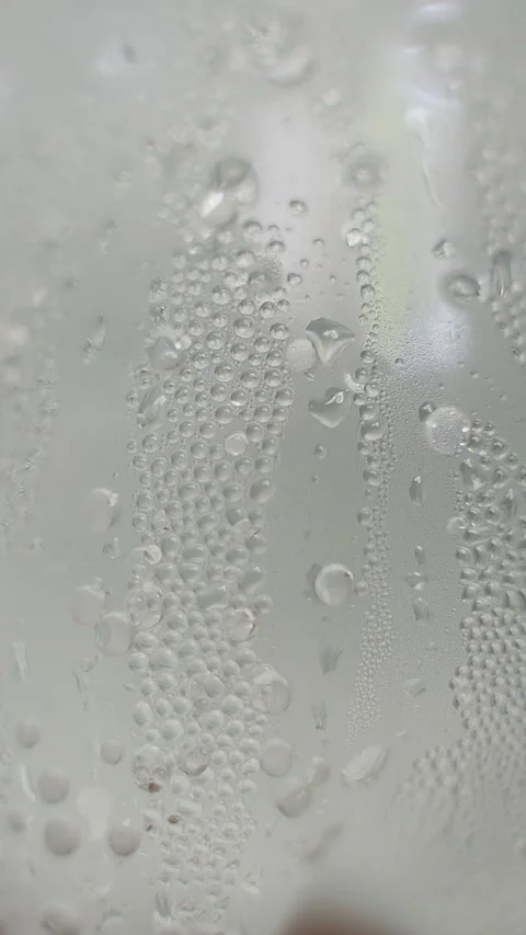 Vertical video. Macro View of Cold Plastic Bottle Covered With Water Condensatio Stock Footage 339015083