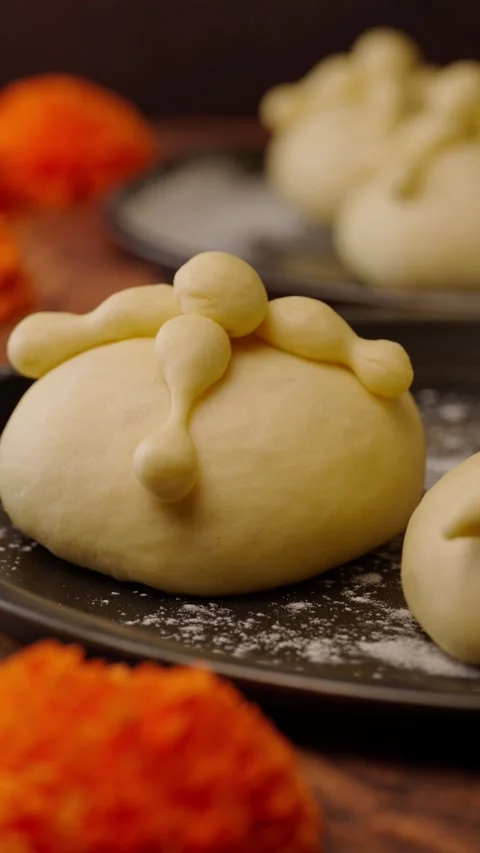 Vertical video, macro view of pan de muerto, traditional Mexican bread Stock Footage 282499693