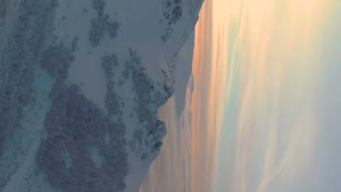 Vertical video of a magical winter sunset over a foggy mountain at Botev peak Stock Footage 230231152