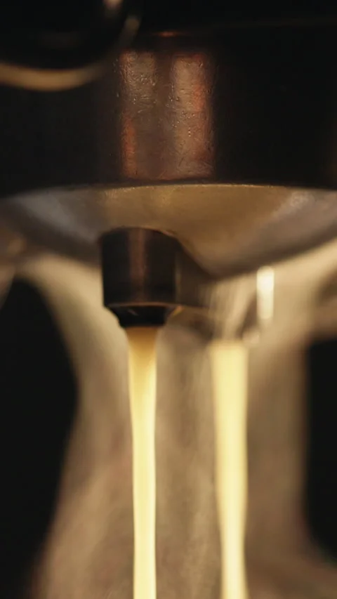 Vertical Video of Making a cup of strong coffee in a coffee machine, the back Stock Footage 305232848