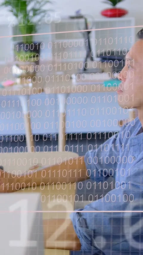 Vertical video: Male analyst moving hand at desk, activating tech charts on Stock Footage 335264175