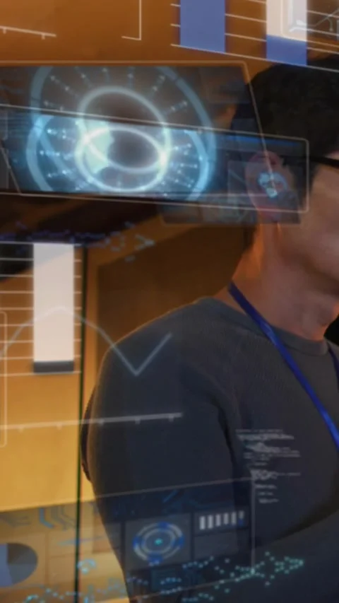 Vertical video: Male analyst scanning charts and code while layered tech panels Stock Footage 330430039