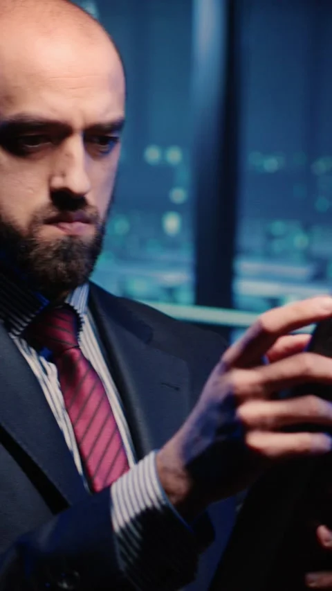 Vertical video: Male database admin checking hosting server on tablet Stock Footage 233277397