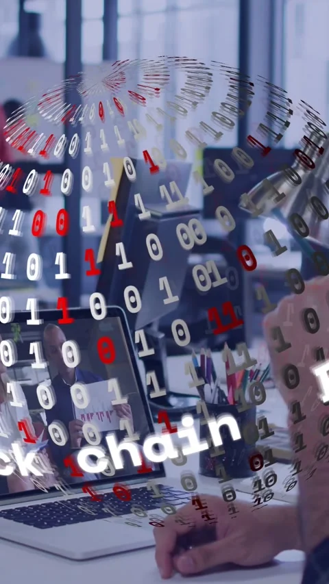 Vertical video: Male dev clicking mouse leaning on laptop rotating binary globe Stock Footage 329128554