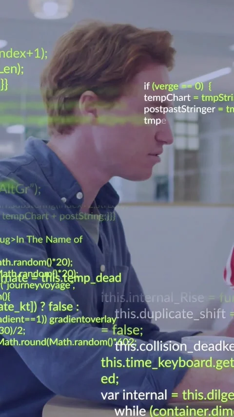 Vertical video: Male dev typing on laptop in office while green code overlaying Stock Footage 334547104