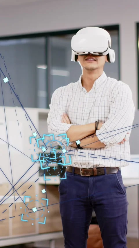 Vertical video: Male dev wearing VR set tilting head and starting moving blue AR Stock Footage 333577725