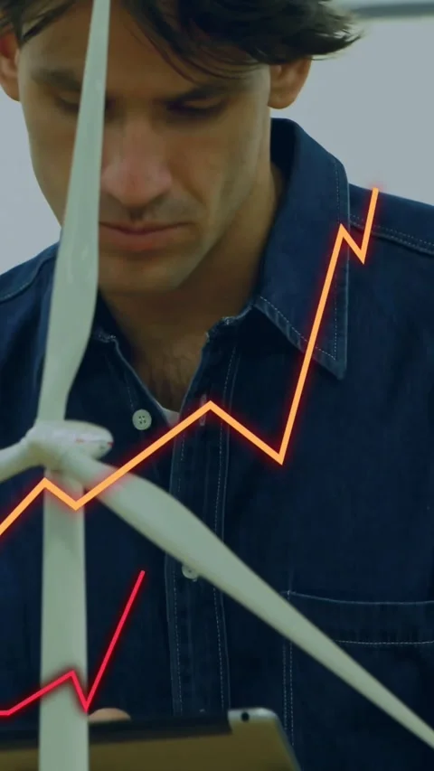 Vertical video: Male engineer tapping tablet, adjusting wind turbine model, Stock Footage 334544208