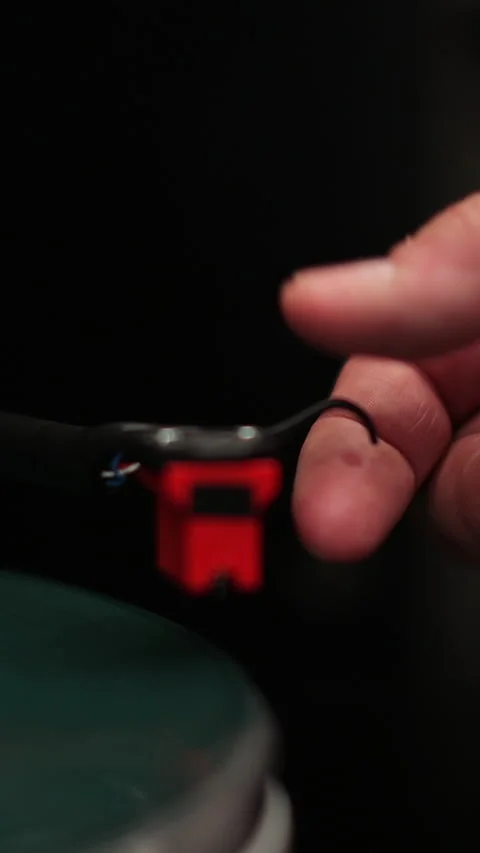 Vertical video Male hands operating vinyl record player with a vinyl disc. Stock Footage 338083427