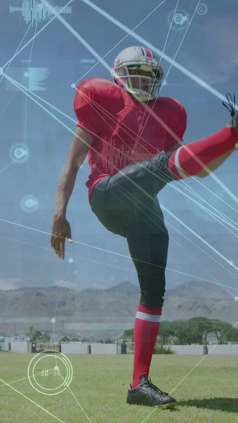 Vertical video: Male kicker practicing shifting and kicking ball on field, Stock Footage 332547081