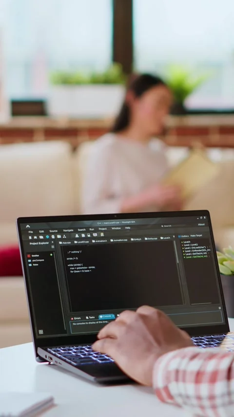 Vertical Video Male programmer developing an app on his laptop and working Stock Footage 319469649