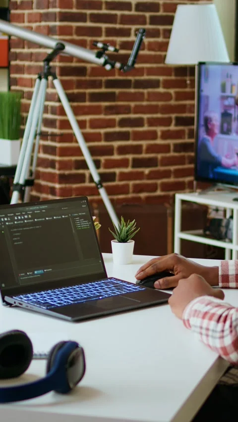 Vertical Video Male programmer developing an app on his laptop and working Stock Footage 319471154
