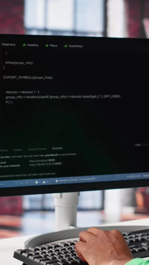 Vertical Video Male programmer types code on computer and running script Video stock 307646113
