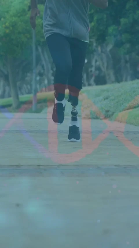 Vertical video: Male runner approaching low camera on path, sparkles on Stock Footage 333157775
