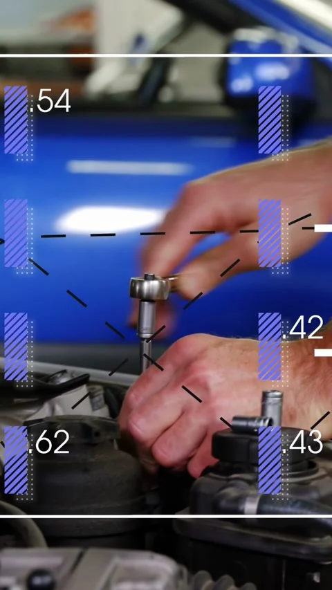 Vertical video: Male tech bringing socket to engine bolt, turning for repair Stock Footage 332734996