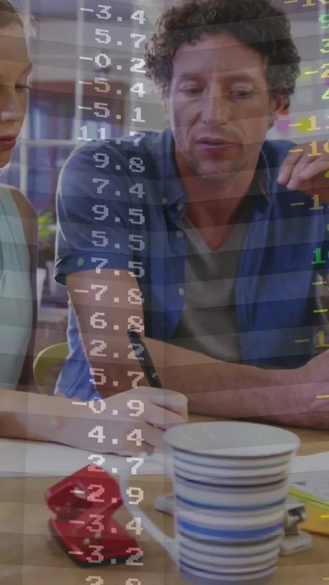 Vertical video: Male tutor pointing at sheet while data overlay appearing Stock Footage 331215935