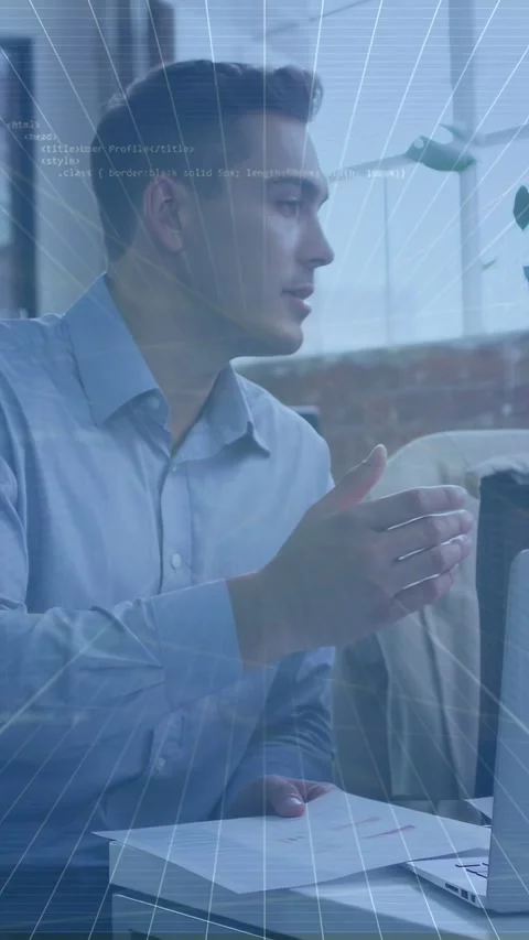Vertical video: Male worker moving papers causing laptop overlay showing Stock Footage 337540763