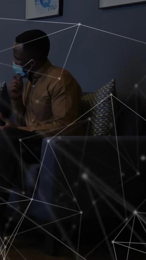 Vertical video: Man adjusting mask then checking phone in health room, overlay Stock Footage 334396495