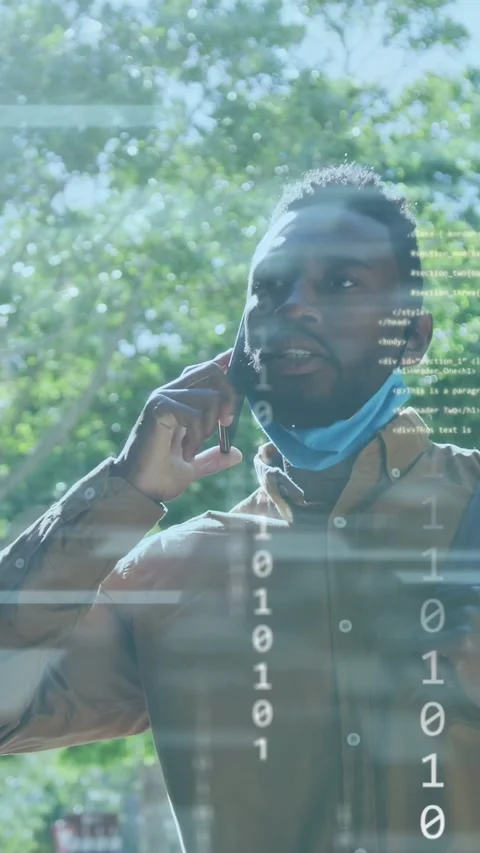 Vertical video: Man answering call, technology binary code columns rising over Stock Footage 337540728