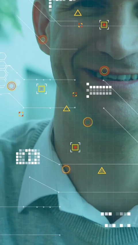 Vertical video: Man approaching in tech office HUD tracking face for alignment Stock Footage 333649799