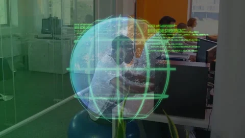 Vertical video: Man on ball typing at tech desk, AR globe with green code Stock Footage 333233692