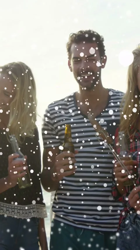 Vertical video: Man with beer and skewer, mingling at BBQ, overlay appearing Video stock 332775730