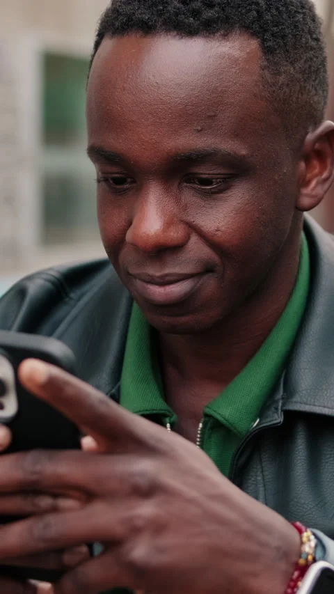 Vertical video, Man Browsing on His Phone in the City Stock Footage 322998022
