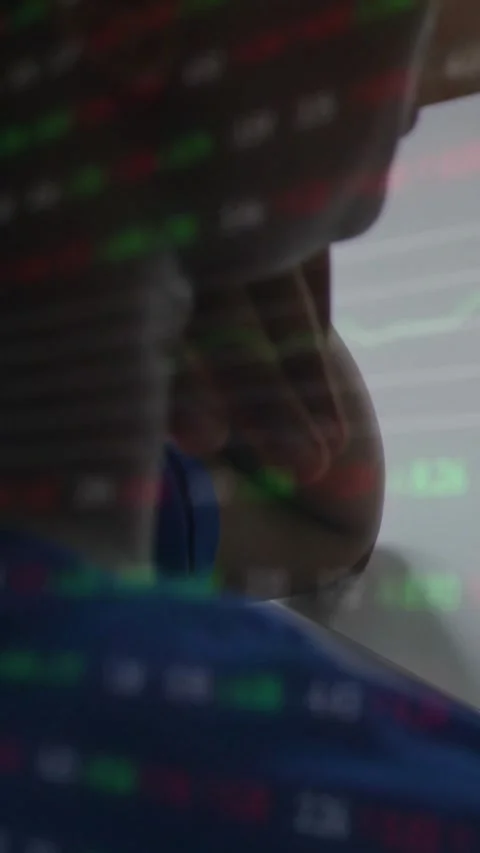 Vertical video: Man checking finance data in cabin, ticker appearing over Stock Footage 331009327