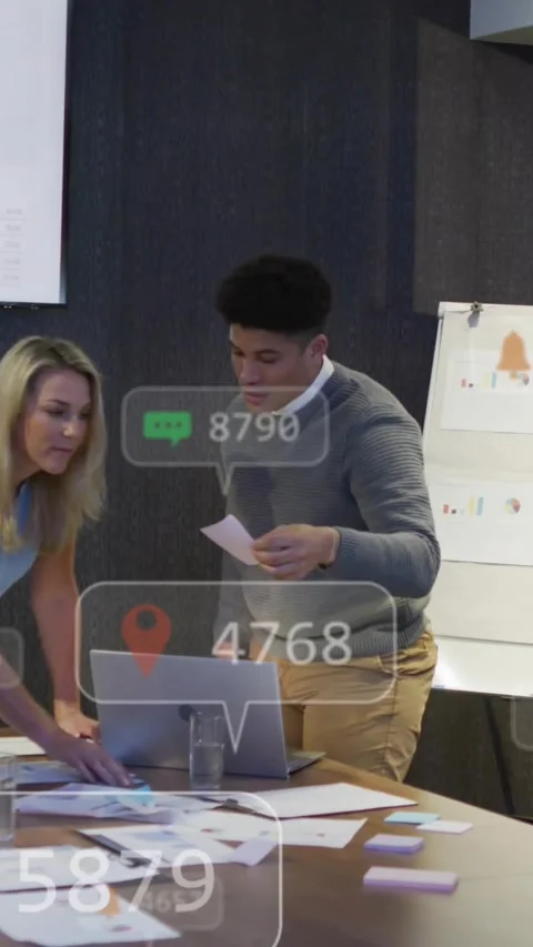 Vertical video: Man checking laptop sorting sticky notes in meeting and updating Stock Footage 329756225